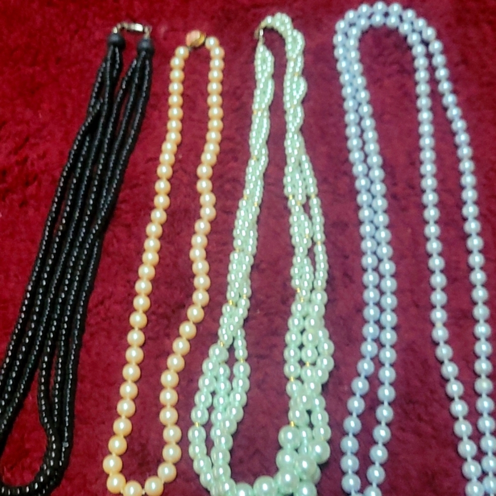 4 different ladies pearls and beadded necklaces